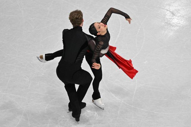 USA's Madison Chock and USA's Evan Bates compete in the figure skating ice dance-free dance final during the Milano Cortina 2026 Winter Olympic Games at Milano Ice Skating Arena in Milan on February 11, 2026. (Photo by Antonin THUILLIER / AFP)