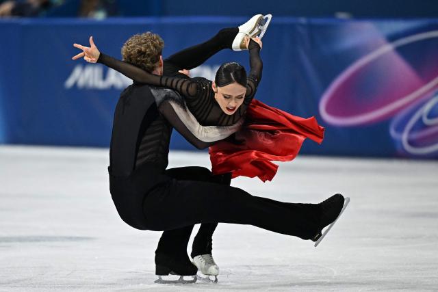 USA's Evan Bates and USA's Madison Chock compete in the figure skating ice dance-free dance final during the Milano Cortina 2026 Winter Olympic Games at Milano Ice Skating Arena in Milan on February 11, 2026. (Photo by Gabriel BOUYS / AFP)