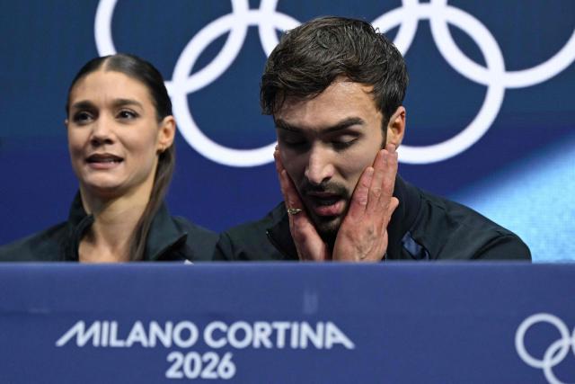 France's Laurence Fournier Beaudry and France's Guillaume Cizeron react in the kiss and cry area after competing the figure skating ice dance-free dance final during the Milano Cortina 2026 Winter Olympic Games at Milano Ice Skating Arena in Milan on February 11, 2026. (Photo by Gabriel BOUYS / AFP)