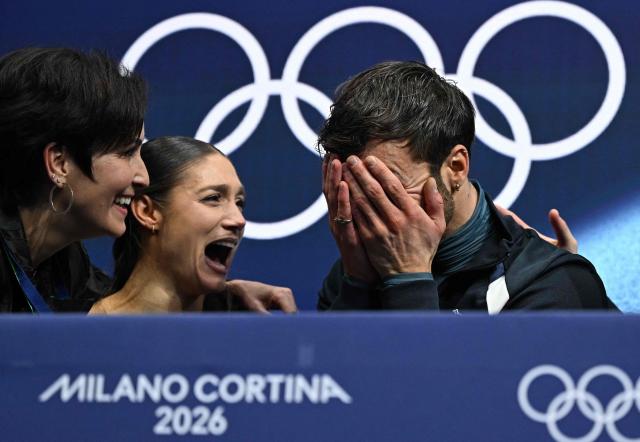 France's Laurence Fournier Beaudry and France's Guillaume Cizeron react in the kiss and cry area after competing the figure skating ice dance-free dance final during the Milano Cortina 2026 Winter Olympic Games at Milano Ice Skating Arena in Milan on February 11, 2026. (Photo by Gabriel BOUYS / AFP)