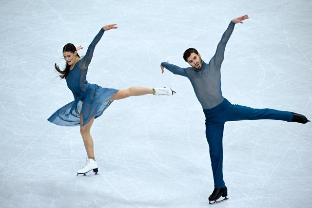 France's Laurence Fournier Beaudry and Guillaume Cizeron compete in the figure skating ice dance-free dance final during the Milano Cortina 2026 Winter Olympic Games at Milano Ice Skating Arena in Milan on February 11, 2026. (Photo by WANG Zhao / AFP)
