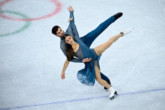 France's Laurence Fournier Beaudry and Guillaume Cizeron compete in the figure skating ice dance-free dance final during the Milano Cortina 2026 Winter Olympic Games at Milano Ice Skating Arena in Milan on February 11, 2026. (Photo by WANG Zhao / AFP)