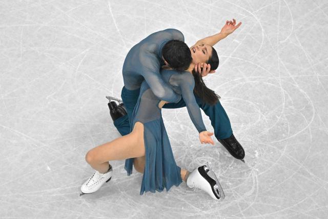 France's Laurence Fournier Beaudry and France's Guillaume Cizeron compete in the figure skating ice dance-free dance final during the Milano Cortina 2026 Winter Olympic Games at Milano Ice Skating Arena in Milan on February 11, 2026. (Photo by Antonin THUILLIER / AFP)