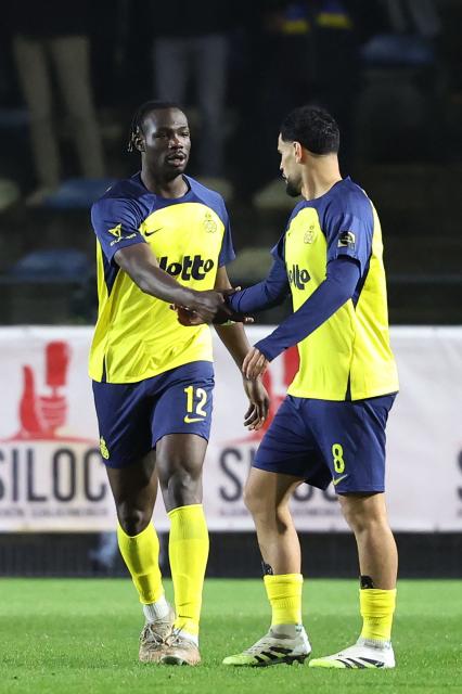 Royale Union Saint-Gilloise's Canadian forward #12 Promise David celebrates scoring his team's first goal during the second leg of the Belgium 'Croky Cup' semifinal football match between Sporting Charleroi and Royale Union Saint-Gilloise at Stade Joseph Marien in Brussels on February 11, 2026. (Photo by VIRGINIE LEFOUR / Belga / AFP) / Belgium OUT