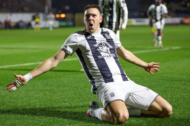 Royal Charleroi SC's French forward #21 Aurelien Scheidler  celebrates scoring his team's first goal during the second leg of the Belgium 'Croky Cup' semifinal football match between Sporting Charleroi and Royale Union Saint-Gilloise at Stade Joseph Marien in Brussels on February 11, 2026. (Photo by VIRGINIE LEFOUR / Belga / AFP) / Belgium OUT