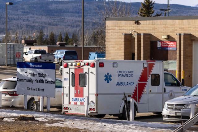 An ambulance is parked at the Community Health Center in Tumbler Ridge, a small town in British Columbia, on February 11, 2026, a day after a shooting took place, leaving at least nine people dead. Canada was in mourning on February 11, Prime Minister Mark Carney said, after a lone shooter killed at least nine people, including seven at a school, and injured dozens more in a remote western town. (Photo by Eagle Vision Agency / AFP)