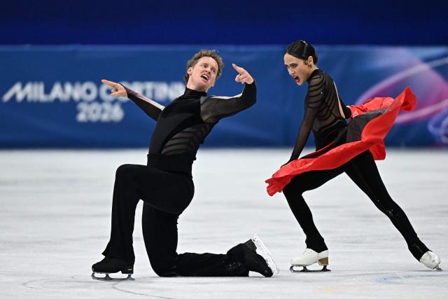 USA's Evan Bates and USA's Madison Chock compete in the figure skating ice dance-free dance final during the Milano Cortina 2026 Winter Olympic Games at Milano Ice Skating Arena in Milan on February 11, 2026. (Photo by Gabriel BOUYS / AFP)
