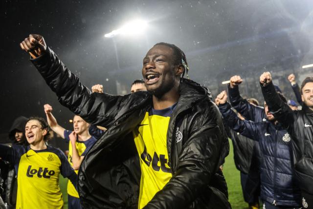 Royale Union Saint-Gilloise's players celebrate after winning the second leg of the Belgium 'Croky Cup' semifinal football match between Sporting Charleroi and Royale Union Saint-Gilloise at Stade Joseph Marien in Brussels on February 11, 2026. (Photo by BRUNO FAHY / Belga / AFP) / Belgium OUT