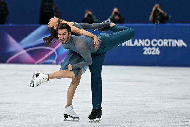 France's Laurence Fournier Beaudry and France's Guillaume Cizeron compete in the figure skating ice dance-free dance final during the Milano Cortina 2026 Winter Olympic Games at Milano Ice Skating Arena in Milan on February 11, 2026. (Photo by Gabriel BOUYS / AFP)