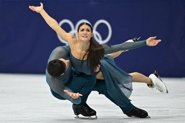 France's Laurence Fournier Beaudry and France's Guillaume Cizeron compete in the figure skating ice dance-free dance final during the Milano Cortina 2026 Winter Olympic Games at Milano Ice Skating Arena in Milan on February 11, 2026. (Photo by Gabriel BOUYS / AFP)