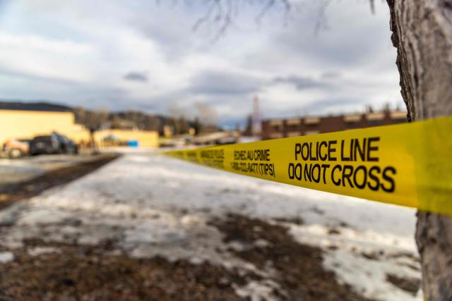 Police tape marks off Tumbler Ridge Secondary School where a mass shooting took place in the small town of Tumbler Ridge, British Columbia, on February 11, 2026. Canadian police said February 11 an 18-year-old carried out a mass shooting in a remote mining town, killing six people at a local school, after slaying her mother and stepbrother. Police commander Dwayne McDonald said authorities still don't know the motive in Tuesday's mass shooting in Tumbler Ridge, but the shooter, who took her own life, was known to have mental health issues. (Photo by Eagle Vision Agency / AFP)