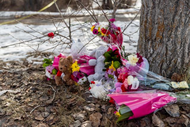 Flowers sit outside Tumbler Ridge Secondary School where a mass shooting took place in the small town of Tumbler Ridge, British Columbia, on February 11, 2026. Canadian police said February 11 an 18-year-old carried out a mass shooting in a remote mining town, killing six people at a local school, after slaying her mother and stepbrother. Police commander Dwayne McDonald said authorities still don't know the motive in Tuesday's mass shooting in Tumbler Ridge, but the shooter, who took her own life, was known to have mental health issues. (Photo by Eagle Vision Agency / AFP)