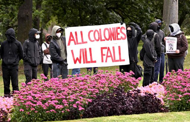 Protesters gather outside Government House upon the arrival of Israel’s President Isaac Herzog in Melbourne on February 12, 2026. Herzog's tightly secured, four-day trip aims to console Australia's Jewish community after the December shooting at Sydney's Bondi Beach that killed 15 people at a Hanukkah festival. (Photo by WILLIAM WEST / AFP)