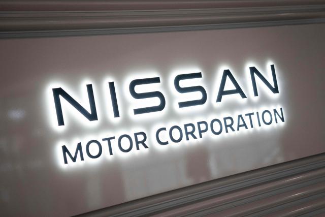 A signage of Japanese automaker Nissan Motor is seen at the company's head office in Yokohama, Kanagawa prefecture on February 11, 2026. (Photo by Yuichi YAMAZAKI / AFP)