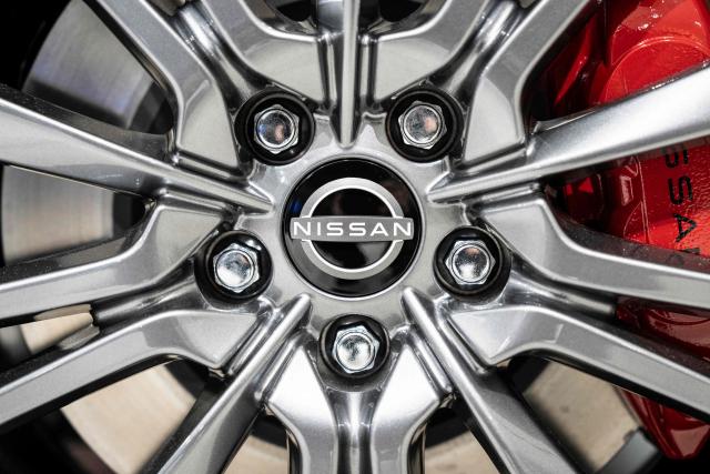 The emblem of Japanese automaker Nissan Motor is seen at a showroom in Yokohama, Kanagawa prefecture on February 11, 2026. (Photo by Yuichi YAMAZAKI / AFP)