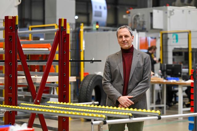 Joerg Jetter, founder and CEO of 4JET, a German firm that makes industrial laser processing technology, poses at the company's headquarters in Alsdorf, western Germany, on February 10, 2026. "In all key industrial sectors, China has changed from a very attractive market into a very capable competitor," Joerg Jetter, CEO of 4JET, a German firm that makes industrial laser processing technology, told AFP. China was long a lucrative market for Germany Inc, but the Asian giant's rise in high-tech fields has put the heat on Europe's industrial powerhouse and its companies, big and small.  4JET, with around 240 employees, has felt the impact first hand: the firm used to have substantial business in solar cell production in China. (Photo by Ina FASSBENDER / AFP)