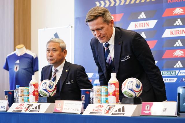 Japan women's national football team head coach Nils Nielsen (R) arrives for a press conference to announce AFC Women’s Asian Cup squad in Tokyo on February 12, 2026. (Photo by Kazuhiro NOGI / AFP)