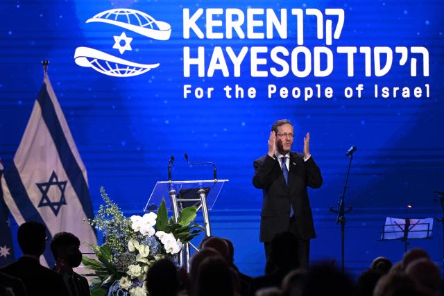 Israel’s President Isaac Herzog reacts during a Jewish community event in Melbourne on February 12, 2026. Herzog's tightly secured, four-day trip aims to console Australia's Jewish community after the December shooting at Sydney's Bondi Beach that killed 15 people at a Hanukkah festival. (Photo by WILLIAM WEST / AFP)