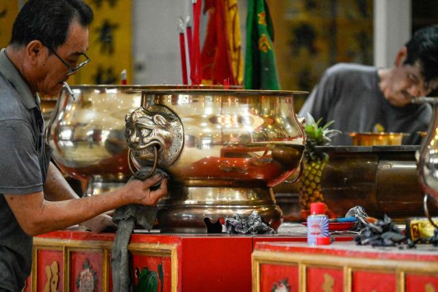 Volunteers clean the Dharma Bakti Temple in Banda Aceh, Indonesia's Aceh province on February 12, 2026, in preparation for the upcoming Lunar New Year of the Horse. (Photo by CHAIDEER MAHYUDDIN / AFP)