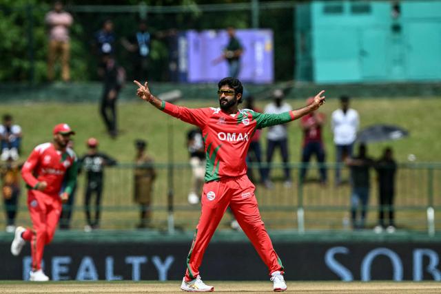 Oman's Jay Odedra celebrates after taking the wicket of Sri Lanka's Kamil Mishara during the 2026 ICC Men's T20 Cricket World Cup group stage match between Sri Lanka and Oman at the Pallekele International Cricket Stadium in Kandy on February 12, 2026. (Photo by Ishara S. KODIKARA / AFP)