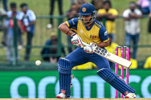 Sri Lanka's Dunith Wellalage plays a shot during the 2026 ICC Men's T20 Cricket World Cup group stage match between Sri Lanka and Oman at the Pallekele International Cricket Stadium in Kandy on February 12, 2026. (Photo by Ishara S. KODIKARA / AFP)