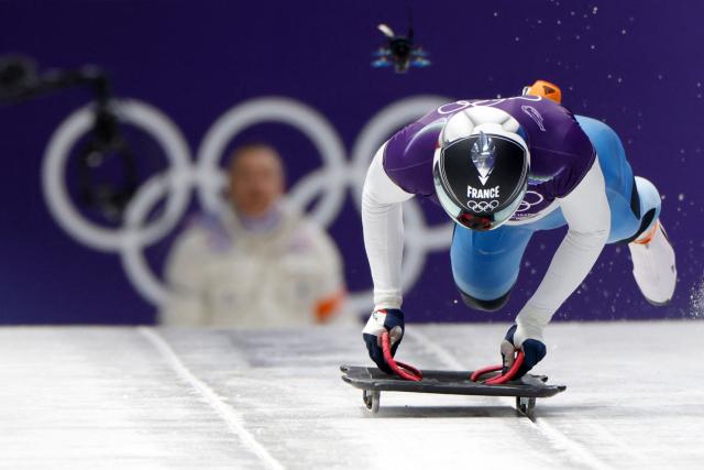 France's Lucas Defayet competes in the skeleton men's heat 1 at Cortina Sliding Centre during the Milano Cortina 2026 Winter Olympic Games in Cortina d'Ampezzo on February 12, 2026. (Photo by Odd ANDERSEN / AFP)