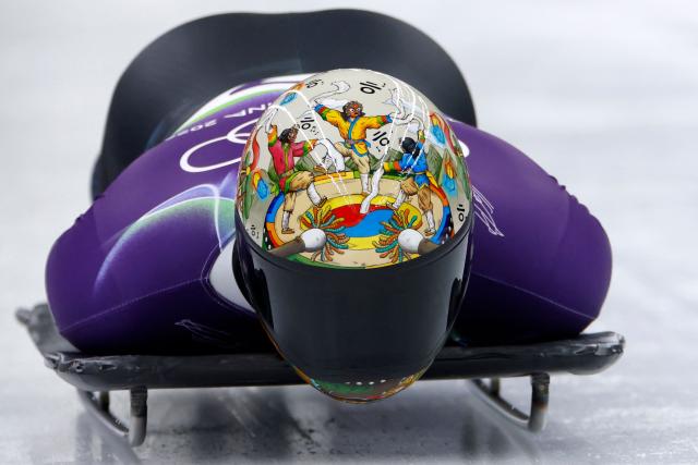 South Korea's Kim Jisoo competes in the skeleton men's heat 1 at Cortina Sliding Centre during the Milano Cortina 2026 Winter Olympic Games in Cortina d'Ampezzo on February 12, 2026. (Photo by Odd ANDERSEN / AFP)