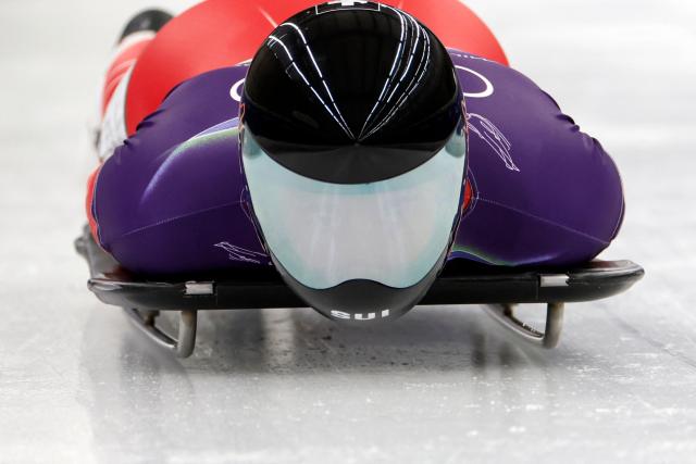 Switzerland's Vinzenz Buff competes in the skeleton men's heat 1 at Cortina Sliding Centre during the Milano Cortina 2026 Winter Olympic Games in Cortina d'Ampezzo on February 12, 2026. (Photo by Odd ANDERSEN / AFP)