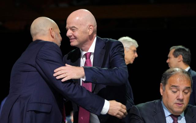 President of the Jordan Football Association Ali bin Hussein (L) embraces FIFA President Gianni Infantino ahead of the start of the 50th UEFA Ordinary Congress in Brussels on February 12, 2026. (Photo by Pau BARRENA / AFP)