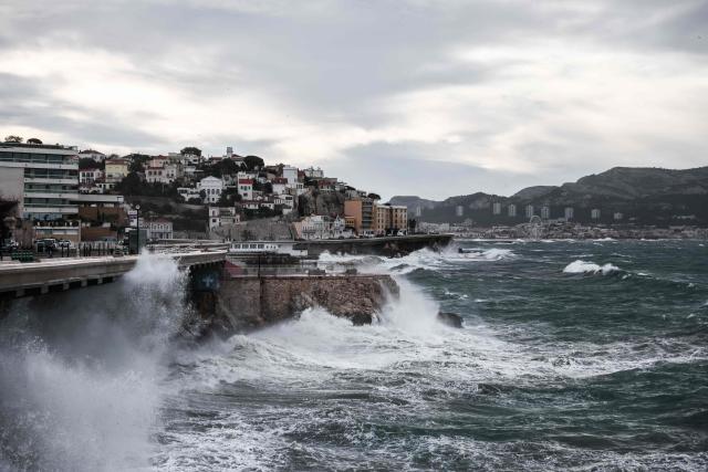 Waves crash against the coastline in Marseille, southern France on February 12, 2026, as Storm Nils hits the area. Accompanied by winds exceeding 160 km/h, Storm Nils swept across several regions of France on February 12, 2026, causing the death of a lorry driver in the Landes and damage, leaving 850,000 homes without electricity, particularly in the southwest. (Photo by Thibaud MORITZ / AFP)