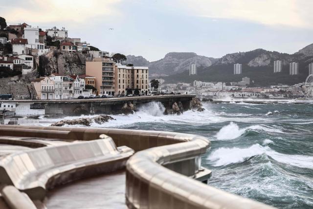 Waves crash against the coastline in Marseille, southern France on February 12, 2026, as Storm Nils hits the area. Accompanied by winds exceeding 160 km/h, Storm Nils swept across several regions of France on February 12, 2026, causing the death of a lorry driver in the Landes and damage, leaving 850,000 homes without electricity, particularly in the southwest. (Photo by Thibaud MORITZ / AFP)