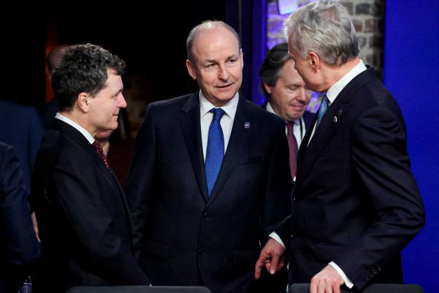 (From L) Romania's President Nicusor Dan, Ireland's Prime Minister Micheal Martin and Lithuania's President Gitanas Nauseda as they take part in the Informal EU Leaders' Retreat at the Alden Biesen Castle in Alden Biesen, central Belgium on February 12, 2026. (Photo by Ludovic MARIN / AFP)