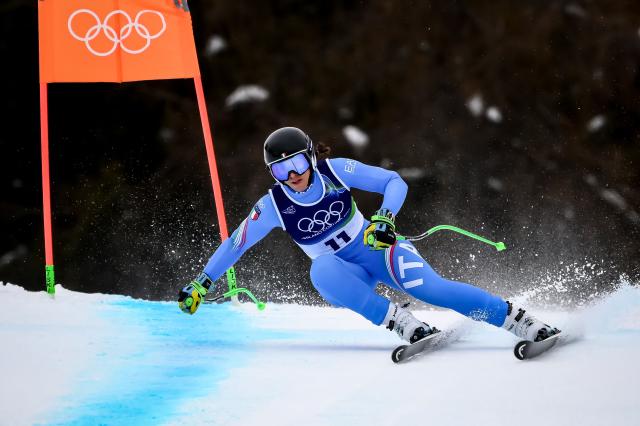 Italy's Elena Curtoni competes in the women's super-G event during the Milano Cortina 2026 Winter Olympic Games at the Tofane Alpine Skiing Centre in Cortina d’Ampezzo on February 12, 2026. (Photo by Marco BERTORELLO / AFP)