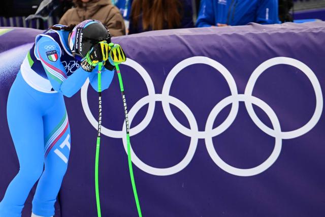 Italy's Elena Curtoni reacts in the finish area of the women's super-G event during the Milano Cortina 2026 Winter Olympic Games at the Tofane Alpine Skiing Centre in Cortina d’Ampezzo on February 12, 2026. (Photo by Stefano RELLANDINI / AFP)