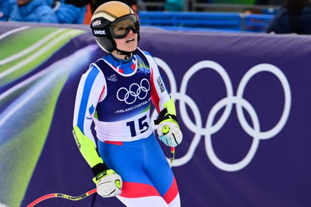 France's Romane Miradoli reacts in the finish area of the women's super-G event during the Milano Cortina 2026 Winter Olympic Games at the Tofane Alpine Skiing Centre in Cortina d’Ampezzo on February 12, 2026. (Photo by Stefano RELLANDINI / AFP)