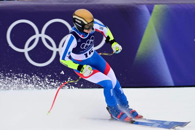 France's Romane Miradoli reacts in the finish area of the women's super-G event during the Milano Cortina 2026 Winter Olympic Games at the Tofane Alpine Skiing Centre in Cortina d’Ampezzo on February 12, 2026. (Photo by Stefano RELLANDINI / AFP)