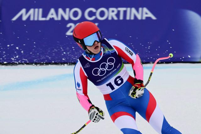 France's Camille Cerutti reacts in the finish area of the women's super-G event during the Milano Cortina 2026 Winter Olympic Games at the Tofane Alpine Skiing Centre in Cortina d’Ampezzo on February 12, 2026. (Photo by Stefano RELLANDINI / AFP)