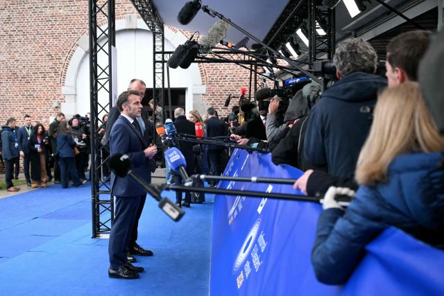 France's President Emmanuel Macron addresses the media during the Informal EU Leaders' Retreat at the Alden Biesen Castle in Alden Biesen, central Belgium on February 12, 2026. (Photo by NICOLAS TUCAT / AFP)
