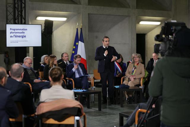 Spokesperson Maud Bregeon (2ndL), Prefect of the Jura department Pierre-Edouard Colliex (3rd-L), Electricite de France (EDF) CEO Bernard Fontana (C-L) and Socialistes et Apparentes' MP Marie-Noelle Battistel listen to the speech of France's Prime Minister Sebastien Lecornu (C) while attending a roundtable at the hydroelectric power plant in Saut-Mortier, eastern France on February 12, 2026. What new energy policy for France in 2035? French government approved on February 12, 2026 a stagnation in electricity consumption, which is leading it to slow down the deployment of onshore wind and solar energy, alongside a massive revival of nuclear power. (Photo by Thomas SAMSON / AFP)