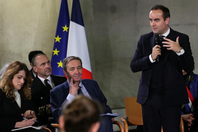 Electricite de France (EDF) CEO Bernard Fontana (C-L) listens to France's Prime Minister Sebastien Lecornu (R) while attending a roundtable at the hydroelectric power plant in Saut-Mortier, eastern France on February 12, 2026. What new energy policy for France in 2035? French government approved on February 12, 2026 a stagnation in electricity consumption, which is leading it to slow down the deployment of onshore wind and solar energy, alongside a massive revival of nuclear power. (Photo by Thomas SAMSON / AFP)
