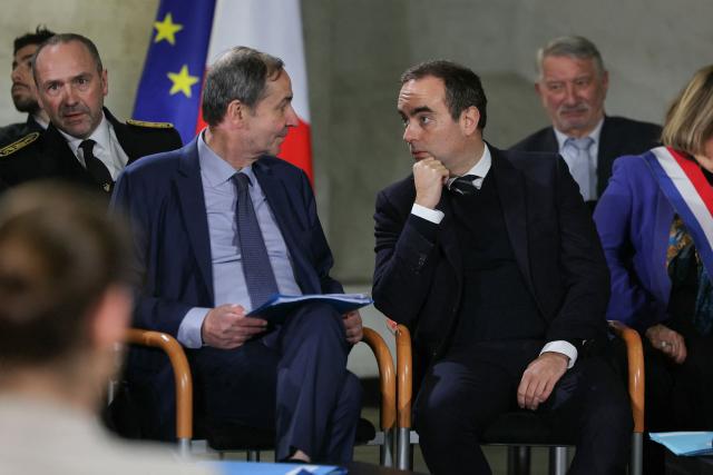 Electricite de France (EDF) CEO Bernard Fontana (C-L) listens to France's Prime Minister Sebastien Lecornu (C) while attending a roundtable at the hydroelectric power plant in Saut-Mortier, eastern France on February 12, 2026. What new energy policy for France in 2035? French government approved on February 12, 2026 a stagnation in electricity consumption, which is leading it to slow down the deployment of onshore wind and solar energy, alongside a massive revival of nuclear power. (Photo by Thomas SAMSON / AFP)