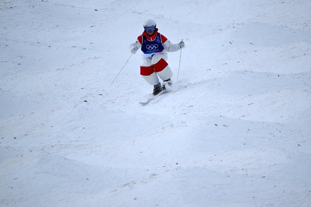 Canada's Mikael Kingsbury competes in the freestyle skiing men's moguls final 1 during the Milano Cortina 2026 Winter Olympic Games at Livigno Aerials & Moguls Park, in Livigno (Valtellina), on February 12, 2026. (Photo by Kirill KUDRYAVTSEV / AFP)