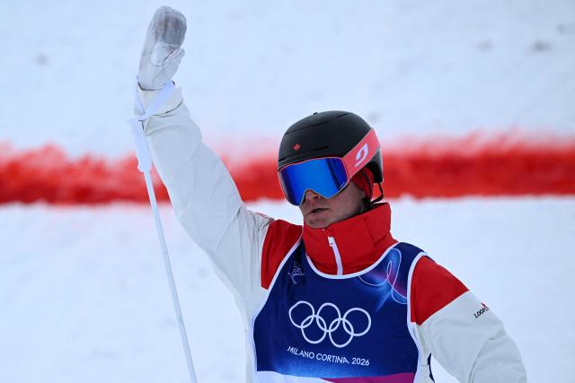 Canada's Julien Viel reacts in the freestyle skiing men's moguls final 1 during the Milano Cortina 2026 Winter Olympic Games at Livigno Aerials & Moguls Park, in Livigno (Valtellina), on February 12, 2026. (Photo by Kirill KUDRYAVTSEV / AFP)