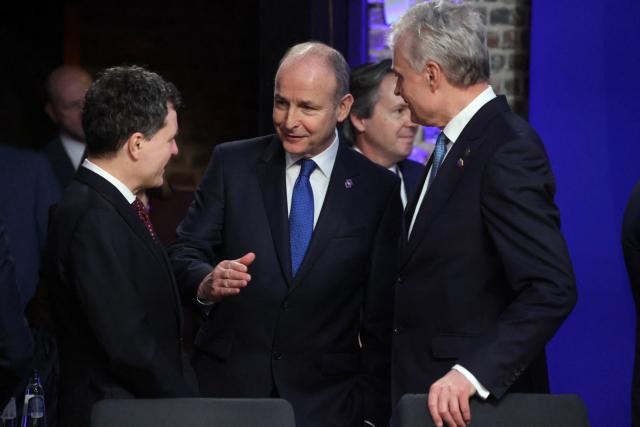 Ireland's Prime Minister Micheal Martin (C) takes part in a meeting during the Informal EU Leaders' Retreat at the Alden Biesen Castle in Alden Biesen, central Belgium on February 12, 2026. (Photo by Ludovic MARIN / AFP)