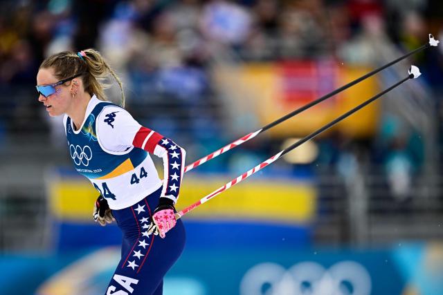 USA's Jessie Diggins takes the start of the women's cross-country skiing 10km interval start free event of the Milano Cortina 2026 Winter Olympic Games at Tesero Cross-Country Skiing Stadium in Lago di Tesero (Val di Fiemme), on February 12, 2026. (Photo by Tobias SCHWARZ / AFP)