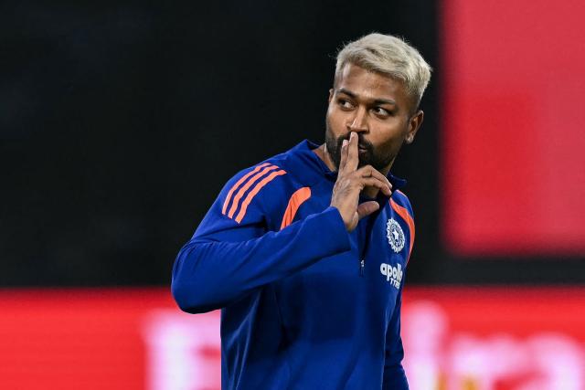 India's Hardik Pandya gestures as he warms up before the start of the 2026 ICC Men's T20 Cricket World Cup group stage match between India and Namibia at the Arun Jaitley Stadium in New Delhi on February 12, 2026. (Photo by Arun SANKAR / AFP)