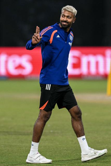India's Hardik Pandya gestures as he warms up before the start of the 2026 ICC Men's T20 Cricket World Cup group stage match between India and Namibia at the Arun Jaitley Stadium in New Delhi on February 12, 2026. (Photo by Arun SANKAR / AFP)