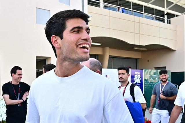Spain's tennis player Carlos Alcaraz visits the track on the second day of the Formula One pre-season testing at the Bahrain International Circuit in Sakhir on February 12, 2026. (Photo by Giuseppe CACACE / AFP)