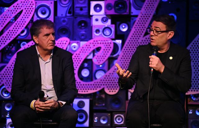 Mayor of Greater Manchester, Andy Burnham (R) and Mayor of Liverpool City Region, Steve Rotherham, speaks on the second day of the Night Time Economy Summit in Liverpool, north-west England on February 12, 2026. (Photo by Paul ELLIS / AFP)