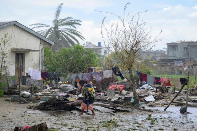 TOPSHOT - A resident walks past a damaged structure in the city of Toamasina, on the east coast of Madagascar, struck by Tropical Cyclone Gezani on February 12, 2026. A cyclone packing violent winds has killed at least 35 people and caused devastation in Madagascar's second-largest city, the Indian Ocean island's disaster authority said Thursday, releasing an updated toll.
Cyclone Gezani made landfall on Tuesday, slamming into the eastern coastal city Toamasina, with winds reaching 250 kilometres (155 miles) per hour.
The National Office for Risk and Disaster Management (BNRGC) on Thursday said it had recorded 35 deaths, while six people remained missing and at least 374 were injured.
More than 8,800 people were displaced, it said. (Photo by Tsiky SIkonina / AFP)
